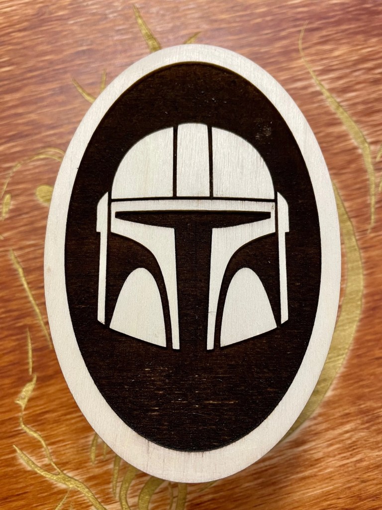 Mandalorian helmet created by laser engraving.